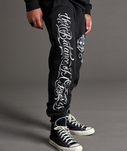 Cargar imagen en el visor de la galería, Jogger para Hombre RVCA MISTER CARTOON PANT BLK
